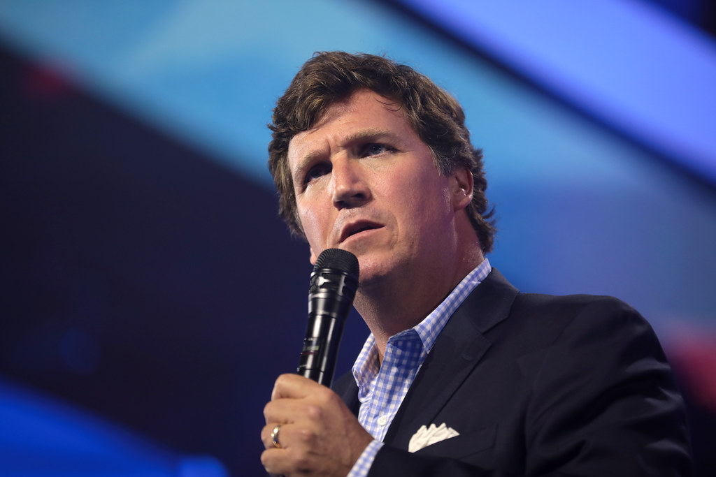 How did Tucker Carlson become one of the far right's most influential voices?