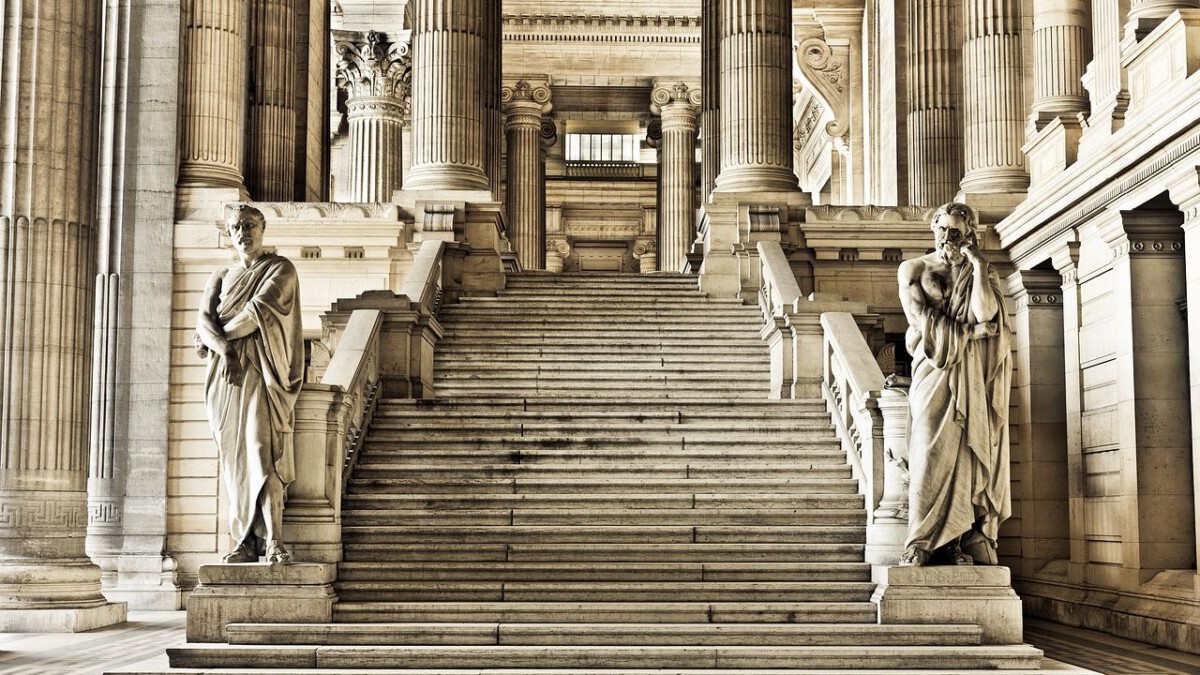 The grand stone steps and columns of a classical courthouse building.